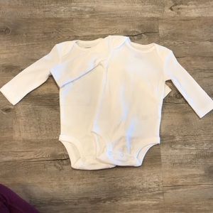 Set of two long sleeve white Carter’s onesies